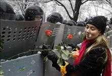 The Orange Revolution, Ukraine, (from 22th of November 2004 until January 2005). Police and orange roses.